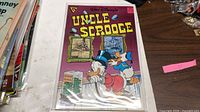 Front cover of Walt Disney Uncle Scrooge comic #238 in sleeve and board