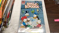 Front cover of Uncle Scrooge comic book issue #260 in sleeve