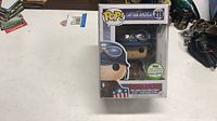 Front view of boxed Funko Pop! Captain America #219 showing figure and convention exclusive sticker