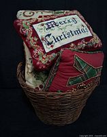 Basket containing visible Christmas pillows
