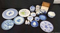 Front view of all 18 blue white china pieces