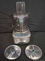 Front view of processor with bowl, lid, and two discs