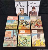 Two sealed Robin Williams DVD box sets and six Reader’s Digest Reading Skill Builder books
