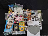 Overview of entire assortment including markers, pencils, brushes, plaque, stickers, tape and embellishments