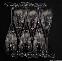 Front view of six Waterford crystal flutes standing together