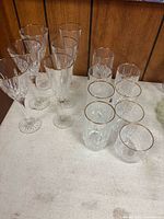 Group of six stemmed goblets and six of the tumblers on table