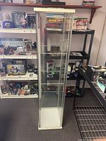 Full view of glass display cabinet front and sides