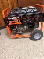 Full view of Generac GP5500 generator showing frame, wheels, control panel