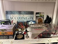 Full lot overview showing board games, sign, figures, props