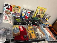 Full lot overview on wire shelf showing all items