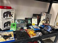 Wide shot of entire lot showing controllers, games, memory cards