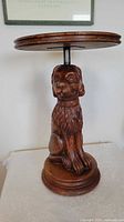 Full view of carved lion dog side table