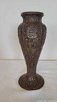 Full view of vase front showing overall shape and relief detail