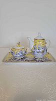 Full view of teapot, sugar bowl, and tray