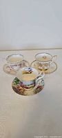 All three teacup and saucer sets