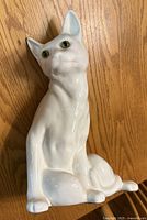 front view of white ceramic cat figurine