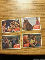 Fronts of four Elvis Presley trading cards showing titles The Fan's Friend, Rescue Ride, Happy Homecoming, Go Back to Venus
