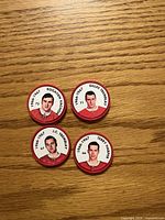 Front view of four Montreal Canadiens hockey coins showing player portraits and names
