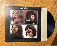 Front cover of The Beatles “Let It Be” sleeve with record partially exposed