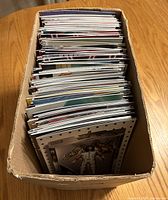 Top view of cardboard box filled with comics