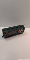 Left side view of green Coca-Cola boxcar