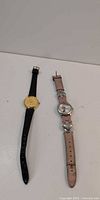 Both Disney watches side by side