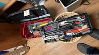 Toolbox with tray and basket view of assorted tools