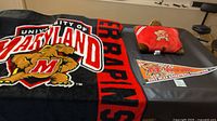 Throw blanket, pillow, pennant displayed together