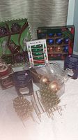Group shot showing boxed ornament sets, loose ornaments and crystal sleigh