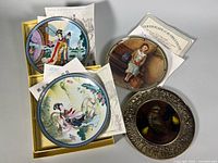 Group shot of all four plates, showing boxes, certificates, artwork.