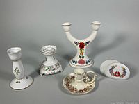 Group of five porcelain candleholders