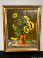 Full view of framed oil painting showing sunflowers in vase