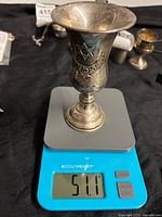 Cup on scale reading 51.1 g