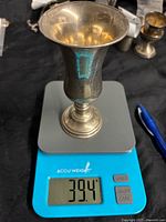 Cup on scale showing 39.4 grams