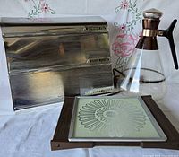 Group shot showing stainless steel triple dispenser, glass percolator and electric warming tray