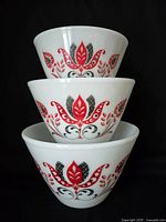 Stacked view of three Modern Tulip bowls showing front graphics