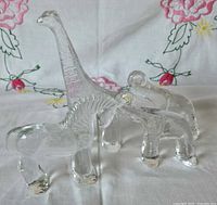 Zebra, giraffe and two elephants grouped