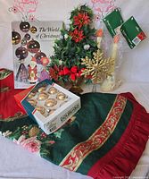 All items grouped: tree skirt, ornaments, book, tabletop tree, candles, snowflake