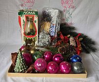 Full lot on tray showing boxed Noma light, ornaments, ceramic tree, tinsel, greenery