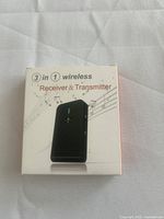 Front of box showing 3-in-1 wireless Receiver & Transmitter and image of device