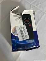Front of damaged retail box displaying breathalyzer image and model marking