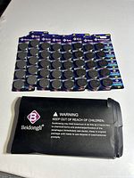 Eight blister cards of 5 Beidongli CR2450 batteries each; outer sleeve below