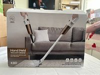 Front of box showing cordless handheld vacuum cleaner model K8D