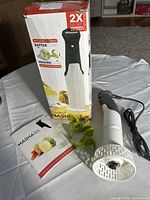 Masher unit, box, instruction booklet, green attachments