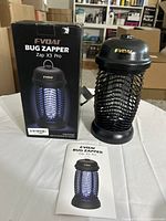 Front of box, bug zapper unit, manual visible