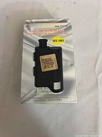 Front of box showing product image, model number 7751W and magnification range