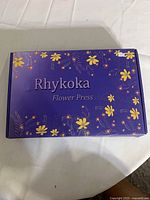 Closed Rhykoka Flower Press box front view
