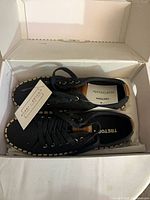 Shoes inside original box with tags visible