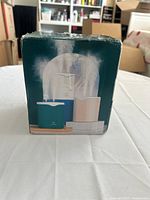 front of retail box showing product image and mist output