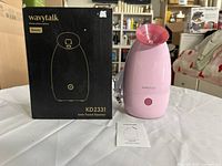 Facial steamer, box front, manual visible